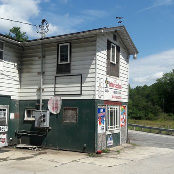 The Intersection - a white building with a sign on it - Convenience Stores Near Me - Eglon, West Virginia