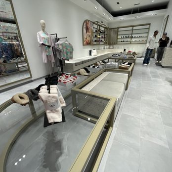 UGG - The image shows the inside of an UGG retail store with shoes, clothing, and accessories on display, and customers shopping. - Shoe Stores Near Me - Bloomington, Minnesota
