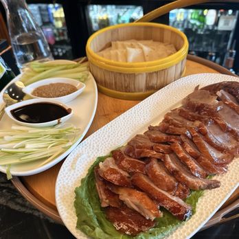 Lao Sze Chuan - HALF Duck with pancake wraps and scallions and cucumbers sliced very thin.  With a sweet sauce for dipping. - Chinese Near Me - Memphis, Tennessee