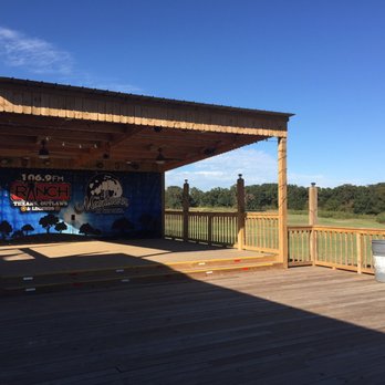 Moontower At The Oaks - a stage on a deck - American Near Me - Corsicana, Texas