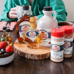 Green Mountain Gift Store - A warm breakfast spread featuring pancakes, fresh fruit, and a variety of organic Vermont maple syrup products. Sweetness perfected!