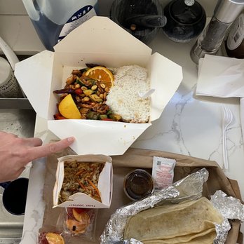 Eliza's - a tray of food and a person's hand - Chinese Near Me - San Francisco, California Eliza's - a tray of food and a person's hand - Chinese Near Me - San Francisco, California