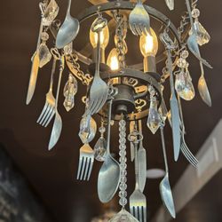 It took a bit to look closely and see the silverware hanging from their cool chandeliers