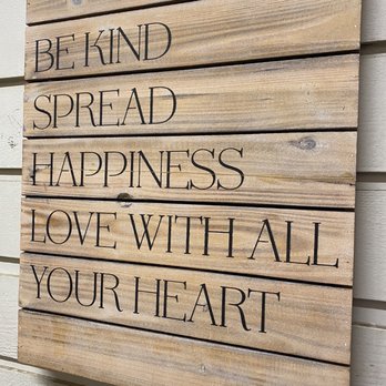 Oasis Vegetarian Cafe - a wooden sign that says behind spread happiness love with all your heart - Vegetarian Near Me - Riverside, California