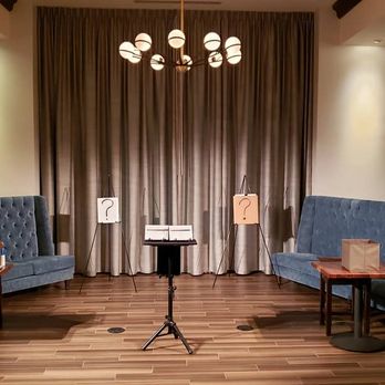 Deceptions Magic Show - two couches and a table - Performing Arts Near Me - Milwaukee, Wisconsin