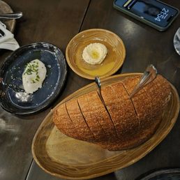 Sourdough, burrata in blue plate, whatever the butter is in the tan plate Sourdough, burrata in blue plate, whatever the butter is in the tan plate