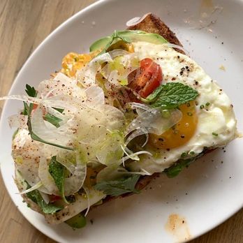 Forêt FLG - Avocado Toast - Seared brioche, avocado, shaved fennel, marinated
heirloom cherry tomatoes, herb salad, chive oil, ancho
chile, fried egg. - Breakfast & Brunch Near Me - Flagstaff, Arizona Forêt FLG - Avocado Toast - Seared brioche, avocado, shaved fennel, marinated
heirloom cherry tomatoes, herb salad, chive oil, ancho
chile, fried egg. - Breakfast & Brunch Near Me - Flagstaff, Arizona
