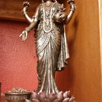 The Herb Store - a statue of a woman holding a pot - Candle Stores Near Me - Albuquerque, New Mexico