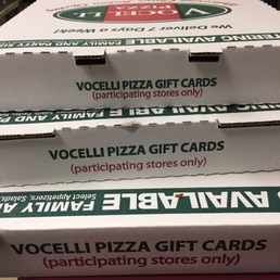 a stack of pizza boxes