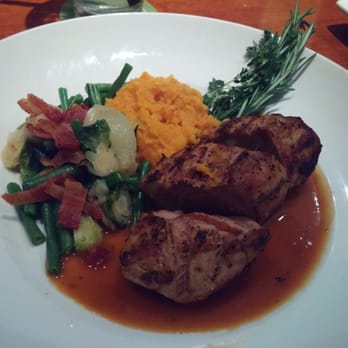 Seasons 52 - Wood grilled pork tenderloin with sweet potato mash and French green beans. - New American Near Me - Jacksonville, Florida