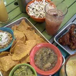 Smokey spicy sweet appetizer (guacamole, street corn salad, pineapple salsa), duck wings (SO GOOD) and maple guava lemonade.