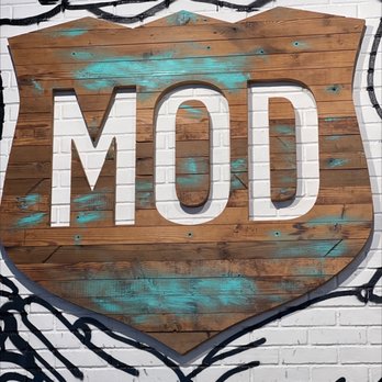 MOD Pizza - a sign painted on a brick wall - Pizza Near Me - Vernon Hills, Illinois