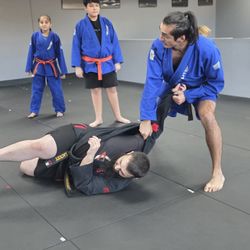 New Vision Sambo - Kids martial arts class practicing Sambo takedowns and grappling drills at New Vision Sambo in Acworth, GA.