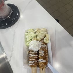 The Paleta Bar - Waffle sticks with Pistachio paleta & fresh, sliced bananas, all drizzled in honey and sprinkled with powder sugar.