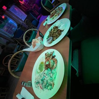 Mango - a long table with plates of food on it - Hookah Bars Near Me - Niles, Illinois