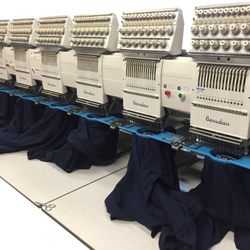 Imperial Promotions - Custom polo shirts being embroidered with a logo