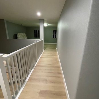 Phoenix Flooring - Upstairs hallway. Notice the curved corners on the baseboards! - Flooring Near Me