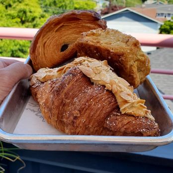 The Flora Bakehouse - From top to bottom: chocolate sea salt croissant, lemon ginger scone, twice-baked almond croissant - Bakeries Near Me - Seattle, Washington