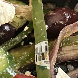 Sticker left on bell pepper in salad. Gross. Sticker left on bell pepper in salad. Gross.