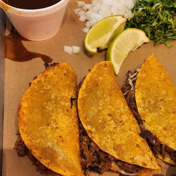 Chilangos Tacos - Birria tacos with consomme, lime, onion, and cilantro - Tacos Near Me - Dallas, Texas
