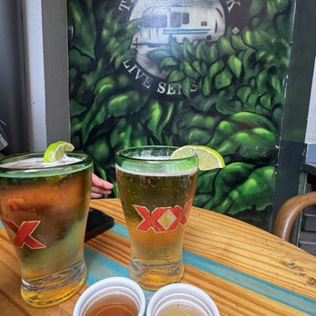 Treylor Park - Dos Equis Lager paired with a pickle back shot. House made pickle juice - New American Near Me - Savannah, Georgia