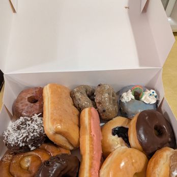 Crispy Donuts-Wichita - A beautiful mixed dozen. The one that's tucked under the chocolate glazed is blueberry cheesecake. The cinnamon roll and bear claw are huge! - Donuts Near Me - Wichita, Kansas Crispy Donuts-Wichita - A beautiful mixed dozen. The one that's tucked under the chocolate glazed is blueberry cheesecake. The cinnamon roll and bear claw are huge! - Donuts Near Me - Wichita, Kansas