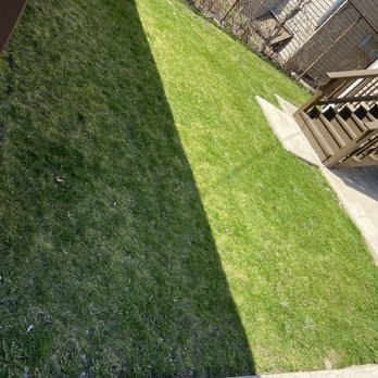 Chris Scaping - a view of a backyard with a lawn and a fence - Lawn Services Near Me Chris Scaping - a view of a backyard with a lawn and a fence - Lawn Services Near Me