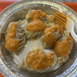 Beef momo with tomato sauce
