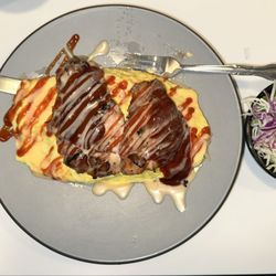 Chicken omelette over rice