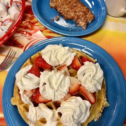 The R's Diner - Waffle with strawberries and whipped cream and a side of corn beef hash