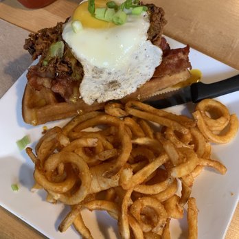 Bites and Pints Gastro Pub - Chicken and Waffle Sandwich with curly fries - Gastropubs Near Me - Greensboro, North Carolina Bites and Pints Gastro Pub - Chicken and Waffle Sandwich with curly fries - Gastropubs Near Me - Greensboro, North Carolina
