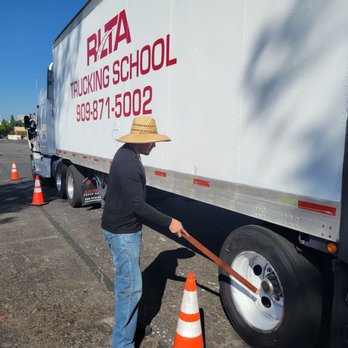Right Lane Trucking School - Student conducting a pre-trip inspection - Driving Schools Near Me - Rialto, California Right Lane Trucking School - Student conducting a pre-trip inspection - Driving Schools Near Me - Rialto, California