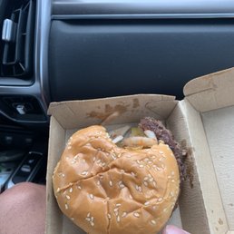 This is a quarter-pounder that had a bite taken out of it by an employee before it was given to us. This is a quarter-pounder that had a bite taken out of it by an employee before it was given to us.