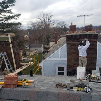 Jose's Painting & Handyman Services - man repairing mortar on high roof - Painters Near Me - Cincinnati, Ohio Jose's Painting & Handyman Services - man repairing mortar on high roof - Painters Near Me - Cincinnati, Ohio