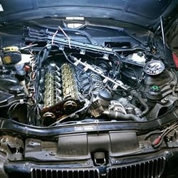 Automotive Services 365 - BMW 335i valve cover gasket and spark plugs. We have the special tools needed to remove the spark plugs on this engine.