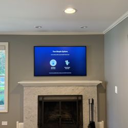 Chicago Mounting - 55 inch Samsung Frame TV installed over the fireplace with the One Connect box hidden behind the TV.
