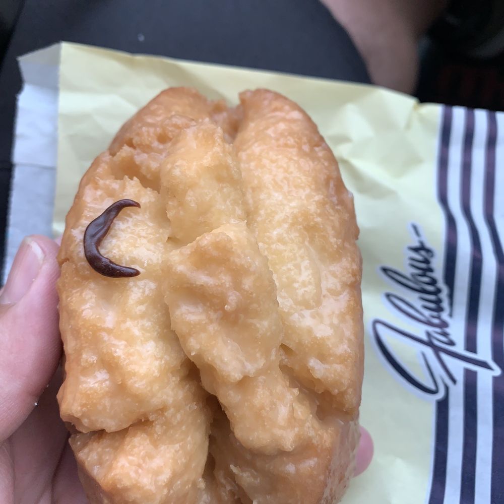Yum Yum Donuts - The elusive glazed buttermilk with a dab of chocolate lol - Donuts Near Me - Madera, California