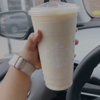 Starbucks - a hand holding a cup of coffee - Coffee & Tea Near Me - Augusta, Georgia