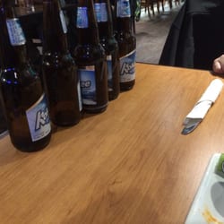 Boston Pizza - Had to go find waitress for each order of drinks....did not clear first bottles until 55mins after being seated.
