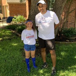 Our daughter and Coach Danny.