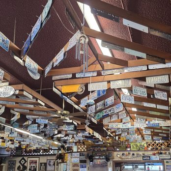 Shirley's Cafe - Low angle shot of ceiling with old license plates in rafters. Some vintage paintings and memorabilia can be seen on the walls. - Breakfast & Brunch Near Me - Port Angeles, Washington Shirley's Cafe - Low angle shot of ceiling with old license plates in rafters. Some vintage paintings and memorabilia can be seen on the walls. - Breakfast & Brunch Near Me - Port Angeles, Washington