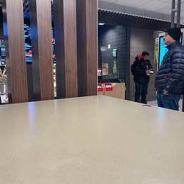 a man standing in front of a counter