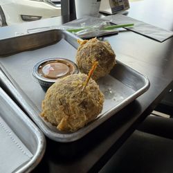 Retreats New Orleans Style Daiquiris & Eats - The boudin balls were high and good. They some type of cheese in them that was very good. The two could have been a meal by themselves.