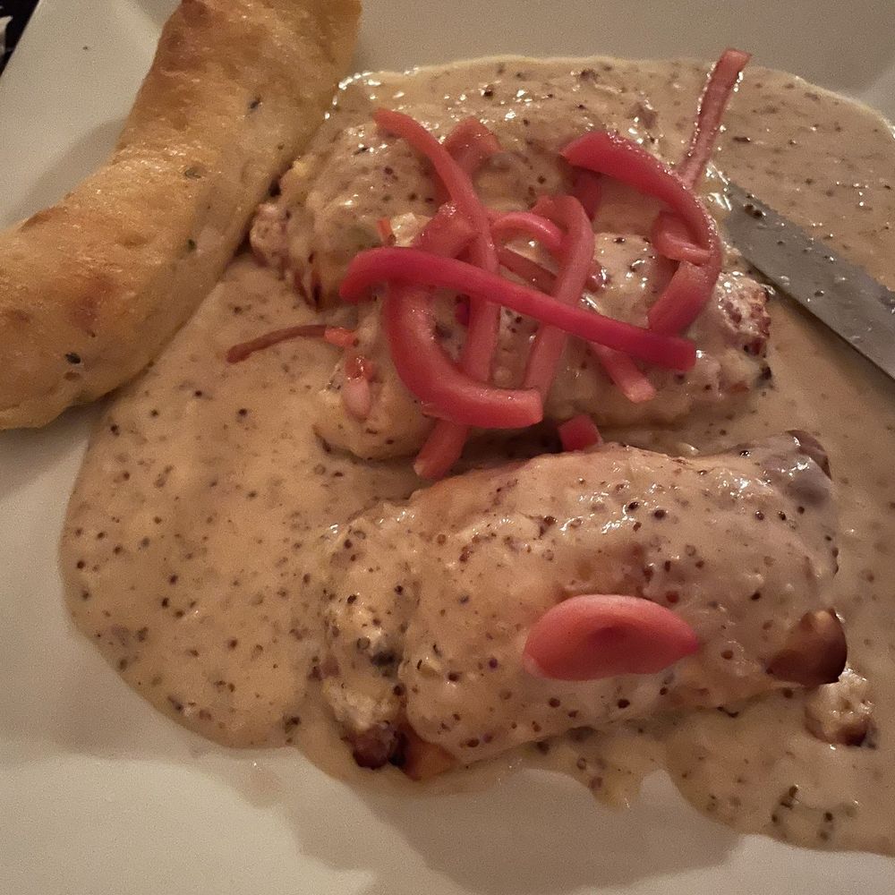 Sauced - a plate of food with bread and a knife - Italian Near Me - Evansville, Indiana