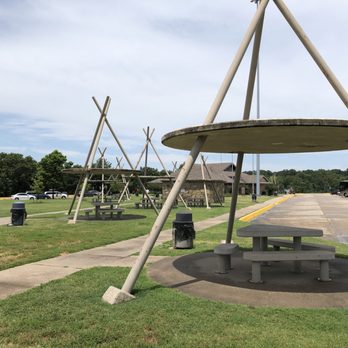 Oklahoma Tourism Information Center - Concrete picnic tables and benches under large iconic "teepees." - Rest Stops Near Me - Gans, Oklahoma Oklahoma Tourism Information Center - Concrete picnic tables and benches under large iconic "teepees." - Rest Stops Near Me - Gans, Oklahoma