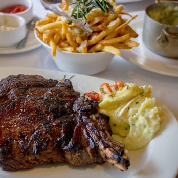 Harbour 60 - Medium Rib Steak with sides of half-size lobster mashed potato and Truffle fries - Steakhouses Near Me - Toronto, Ontario
