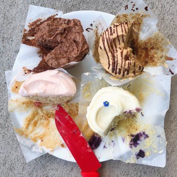 Baked & Wired - Four cupcakes - top left: chocolate, top right: Elvis impersonator, bottom right: smurfette, bottom left: strawberry - Bakeries Near Me - Washington, DC, District of Columbia