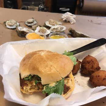 I Got Your Crabs - Crab cake sandwich and a half of dozen of oysters!!!  soooo good!!!! - Seafood Near Me - Kitty Hawk, North Carolina