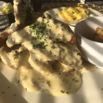 KitchenCray Cafe - Turkey Sausage gravy over chicken biscuits. - Breakfast & Brunch Near Me - Lanham, Maryland