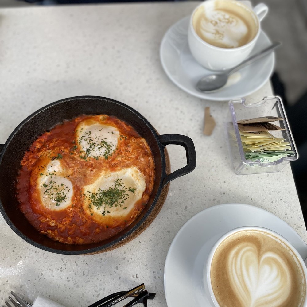 Angelina's Eatery + Cafe - Shakshuka and Cafe con Leche - Coffee & Tea Near Me - Miami, Florida Angelina's Eatery + Cafe - Shakshuka and Cafe con Leche - Coffee & Tea Near Me - Miami, Florida